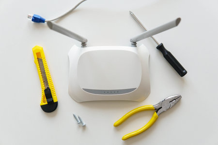 Repairing tools with a wireless wifi router on the table. Top view.の写真素材
