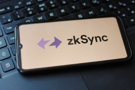 San Franciso, USA - March 16, 2023: Phone with ZkSync logo on the laptop keyboard. ZkSync is a Layer-2 protocol that scales Ethereum with cutting-edge ZK tech. Cryptocurrency, airdrop.のeditorial素材