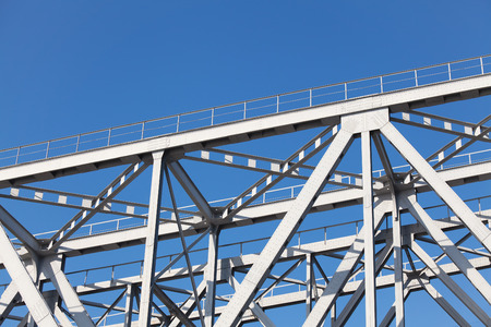 Steel structures truss bridge on background of blue skyの写真素材