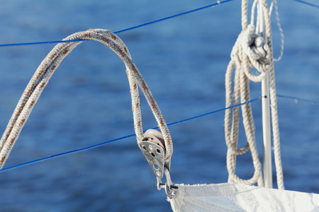 Rope stretched around a winch on a sailing vessel closeupの写真素材