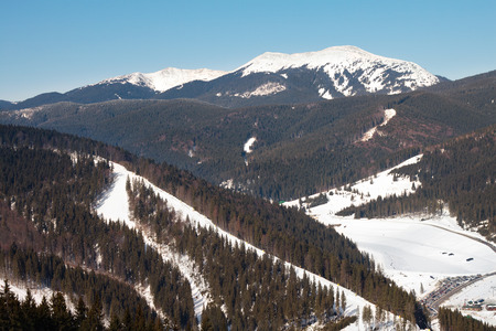 View of the ski slope in the ukrainian Carpathian mountains in winterの写真素材
