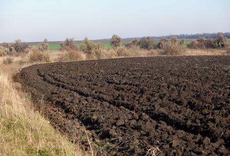 Edge of field after plowing in autumnの写真素材