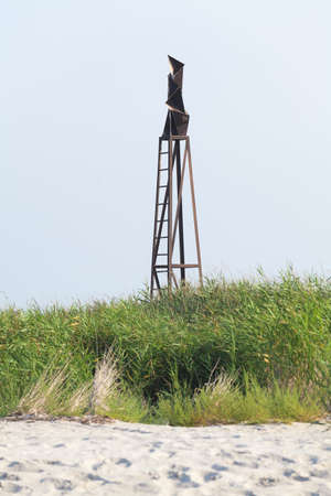 Old soviet iron reflector radar signal on the beachの写真素材