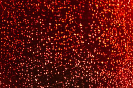 Multicolored abstract red bokeh background with blurred starry skyの写真素材