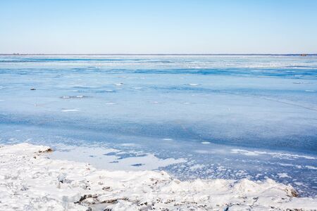 Beautiful landscape. Wide frozen river bright sunny day