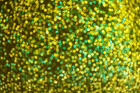 Gold and green abstract background with bokeh festive lights