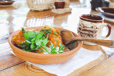 Stuffed cabbage in clay plate in national Ukrainian restaurant