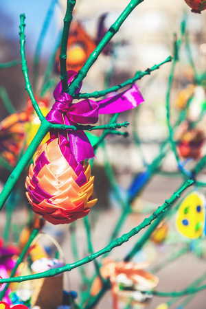 Handmade toy weighs painted tree branch spring day
の写真素材