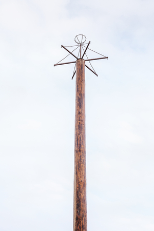 High wooden pole with cross bars for gifts at the top of a climbing on the traditional Slavic holiday Maslenitsa
の写真素材