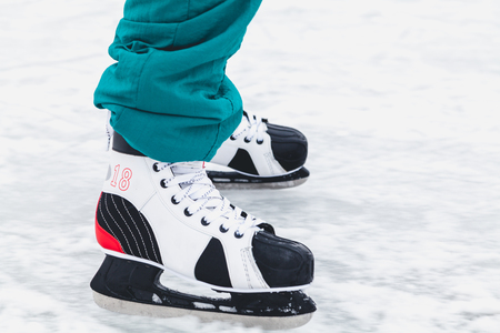 winter fun. A man is riding a new skate on a natural open-air skating rink
の写真素材
