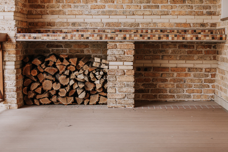empty veranda with a brick wall. In the niche stacked firewoodの写真素材