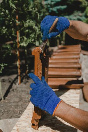 master covers the side edges of the tile with a protective agent with a brush.の写真素材