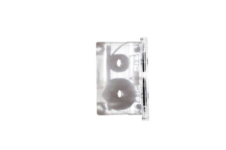 Original perspective. The audio cassette with a transparent case stands perpendicularly on a white...