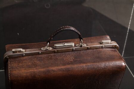 Doctor antique leather case stands inside a transparent boxの写真素材