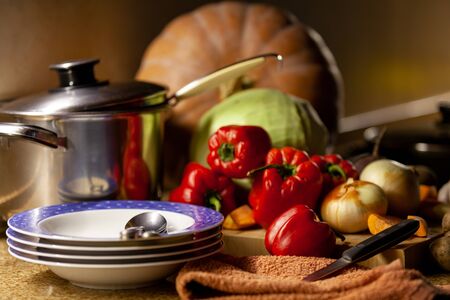 Kitchen Still Life. Deep dish, casserole, pumpkin, cabbage, sweet pepper, onion on the table

の写真素材