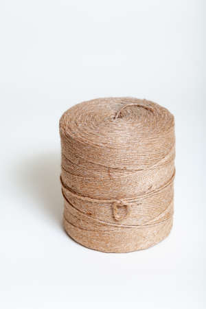 new roll of jute cord on a white backgroundの写真素材