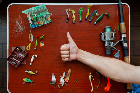 Fishing is good. A spinning coil and a set of different baits for catching predatory fish are laid...