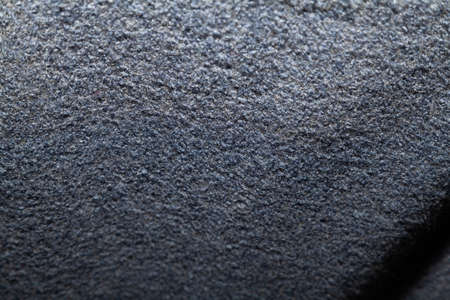 Texture of gray woolen fabric with a rough surface close upの写真素材