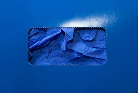 Hand protection. New blue rubber gloves in an open cardboard box. Medical gloves for examination close upの写真素材