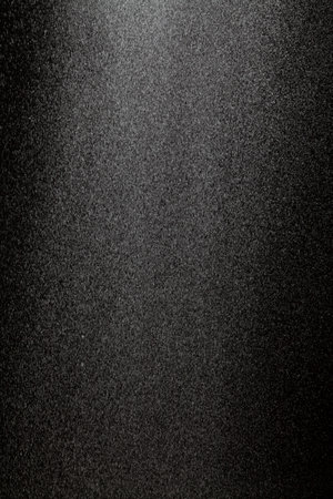 Abstract background with small drops. Wide vertical stripe of small white particles on a black backgroundの写真素材