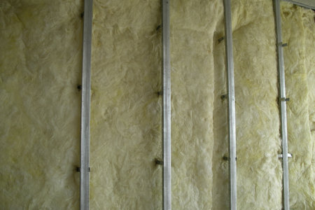 A frame made of metal guides for the future construction of an interior partition inside the apartment. Opposite the windowの写真素材
