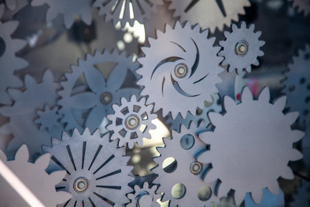Many different stainless steel gears with metallic tint as background. Abstract technical background. Illustration for banner, poster, cover, brochure or presentationの写真素材