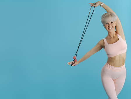 Beautiful athletic woman doing stretching. COPY SPACE