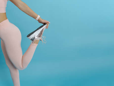 Beautiful athletic woman doing stretching. COPY SPACE