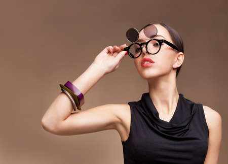 Sexy brunette beautiful woman wearing glasses Studio shotの写真素材