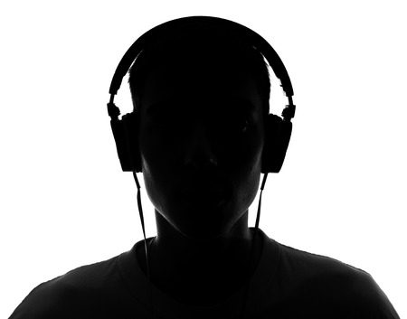 Male silhouette with headphones Isolated on white の写真素材