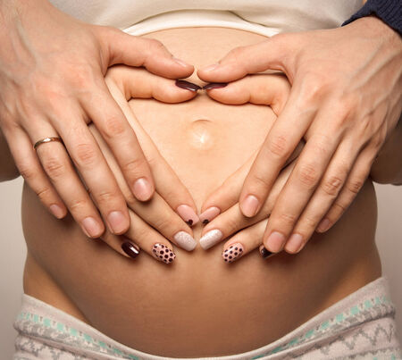 Heart shaped pregnancyの写真素材