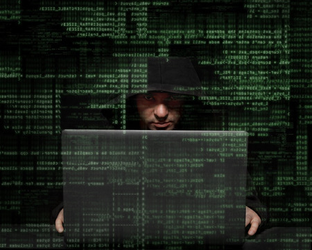 Silhouette of a hacker uses a command on graphic user interface 