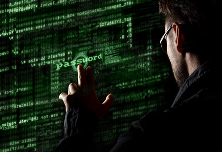 Silhouette of a hacker uses a command on graphic user interface の写真素材