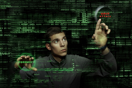Silhouette of a hacker uses a command on graphic user interface の写真素材