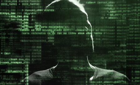 Silhouette of a hacker uses a command on graphic user interface の写真素材