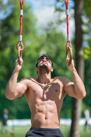 Athlete doing exercises at stadiumの写真素材