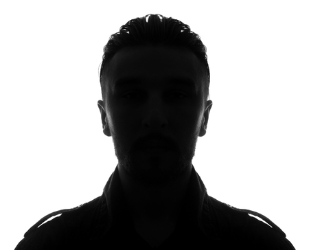 Hidden face in the shadow.male person silhouetteの写真素材