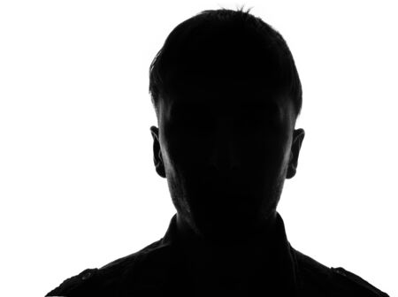 Hidden face in the shadow.male person silhouetteの写真素材