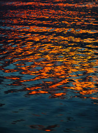 Abstract colorful pattern formed by a water reflection of a sunlitの写真素材