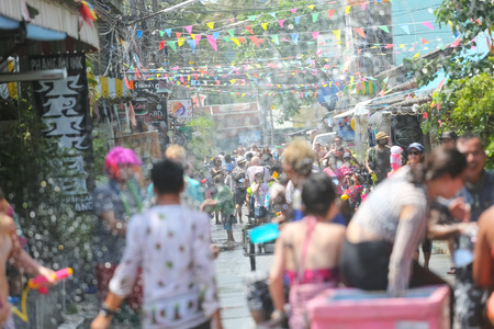 Koh Phangan island, Thailand - April 13 2017: Unidentified tourists shooting water on Songkran Festival ( Thai New Year ) at Thongsala streetsのeditorial素材