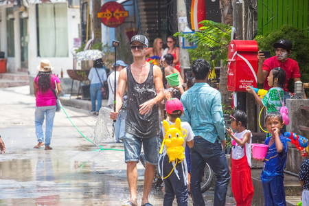 Koh Phangan island, Thailand - April 13 2017: Unidentified tourists shooting water on Songkran Festival ( Thai New Year ) at Thongsala streetsのeditorial素材