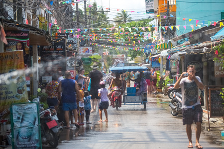 Koh Phangan island, Thailand - April 13 2017: Unidentified tourists shooting water on Songkran Festival ( Thai New Year ) at Thongsala streetsのeditorial素材