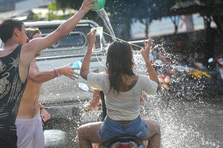 Koh Phangan island, Thailand - April 13 2017: Unidentified tourists shooting water on Songkran Festival ( Thai New Year ) at Thongsala streetsのeditorial素材