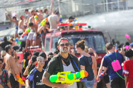Koh Phangan island, Thailand - April 13 2017: Unidentified tourists shooting water on Songkran Festival ( Thai New Year ) at Thongsala streetsのeditorial素材