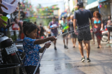 Koh Phangan island, Thailand - April 13 2017: Unidentified tourists shooting water on Songkran Festival ( Thai New Year ) at Thongsala streetsのeditorial素材