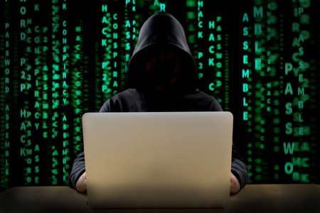 Hacker at work with graphic user interface around