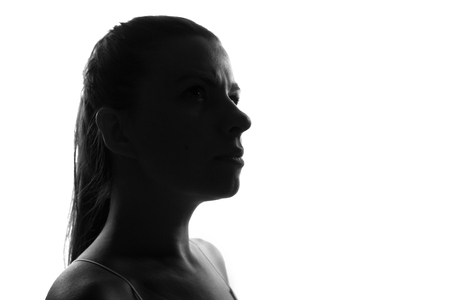 Female person silhouette,back lit lightの写真素材