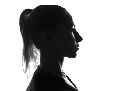 Female person silhouette,back lit lightの写真素材