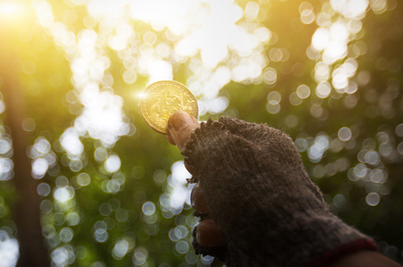 bitcoin in the hands of the miner. Mining Golden Bitcoinsの写真素材