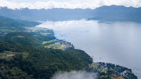Rice field parts and fish farming divided to plots by water channels and pathways,aerial shot, West Sumatra,Maninjau lake area,Indonesiaの写真素材